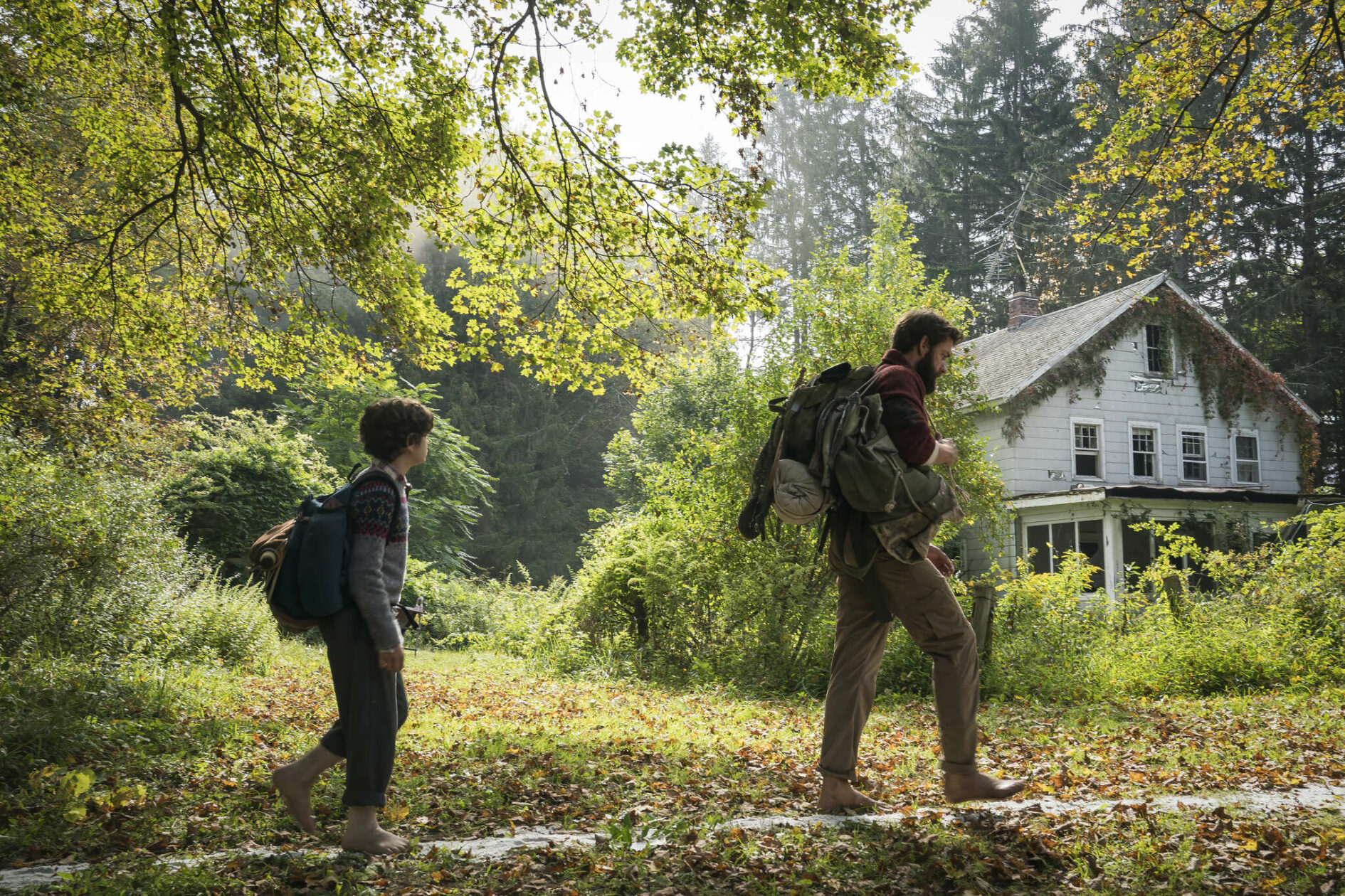 Left to right: Noah Jupe plays Marcus Abbott and John Krasinski plays Lee Abbott in A QUIET PLACE, from Paramount Pictures.